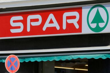 The logo of Austrian supermarket chain Spar is seen behind a traffic sign at a shop in Vienna