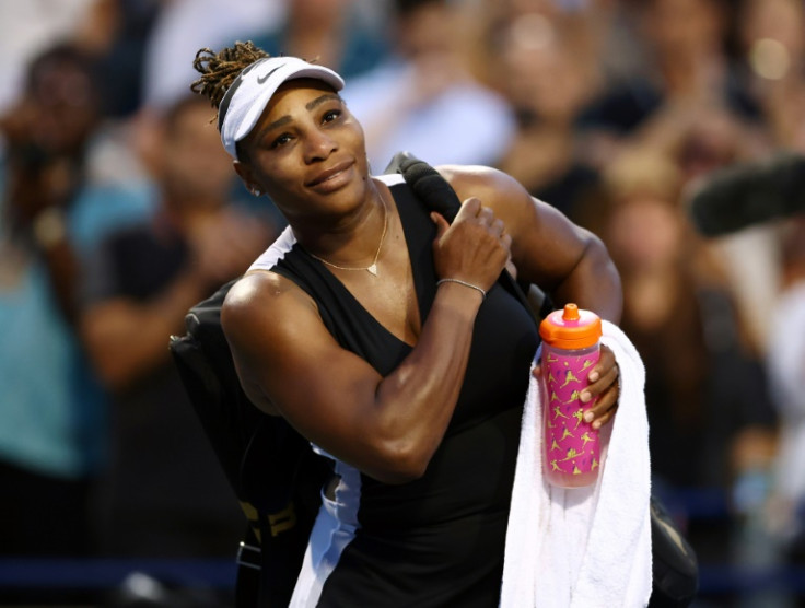 American Serena Williams smiles as she leave the court after losing to Belinda Bencic of Switzerland in the second round of the WTA Toronto Masters