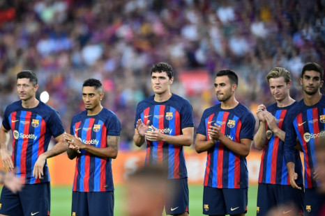 (From L) Summer signings Robert Lewandowski, Raphinha and Andreas Christensen line up alongside their new Barcelona teammates
