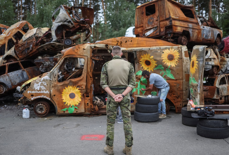 Artists painte cars destroyed during Russia's attack on Ukraine in Irpin