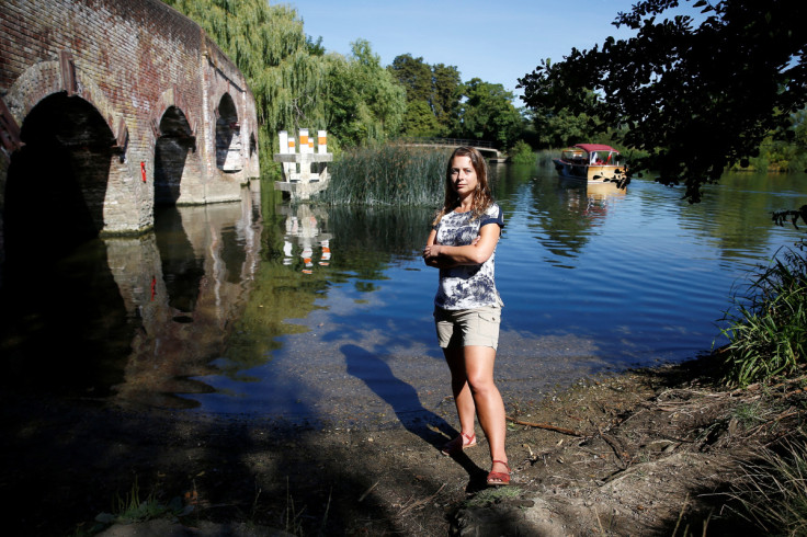 Climate scientist, Professor Hannah Cloke, poses for a photograph on the banks of the River Thames in Sonning