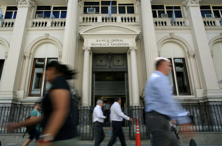 Pedestrians pass by Argentina's Banco Central (Central Bank) in Buenos Aires' financial district