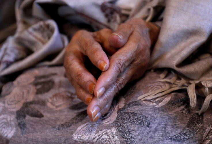 Massouda Kohistani's mother sits after speaking with Massouda over a video call, at a house in Kabul