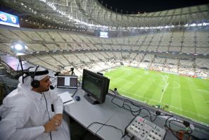 A commentator prepares for the Qatar Stars League match between Al-Arabi and Al-Rayyan at the Lusail stadium, the venue for the World Cup final