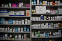 Bottles of medications line the shelves at a pharmacy in Portsmouth