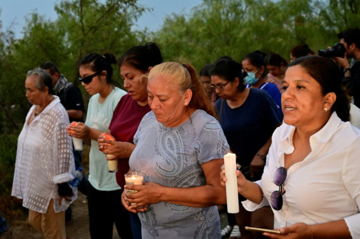 Friends and relatives hold a candlelit vigil for the trapped miners