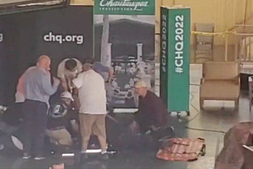 Author Salman Rushdie is helped by people after he was stabbed at the Chautauqua Institution