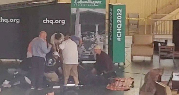 Author Salman Rushdie is helped by people after he was stabbed at the Chautauqua Institution