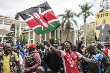 Supporters of Odinga's coalition gathered in downtown Nairobi near a poster of his rival Ruto