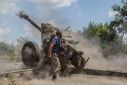 Ukrainian serviceman fires with a D-30 howitzer near a frontline in Mykolaiv region