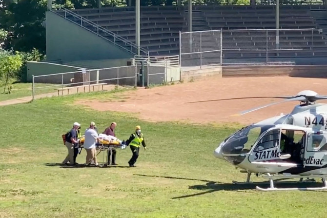 Author Salman Rushdie is transported to a helicopter after he was stabbed at the Chautauqua Institution