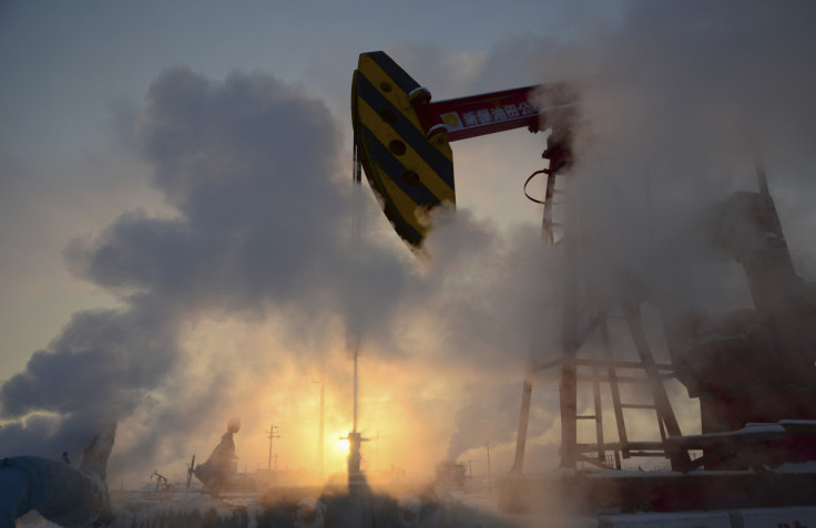 FILE PHOTO -A pump jack is seen surrounded by steam during sunset at a PetroChina's oil field in Karamay
