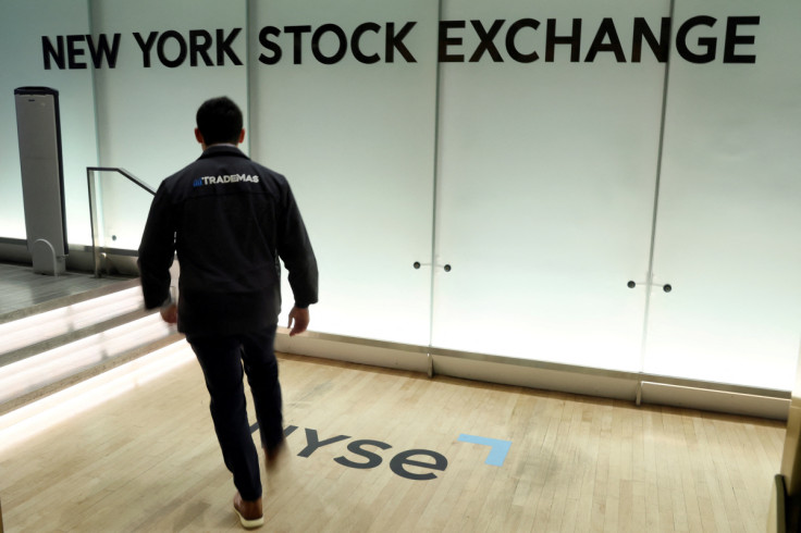 A trader enters the floor of the New York Stock Exchange