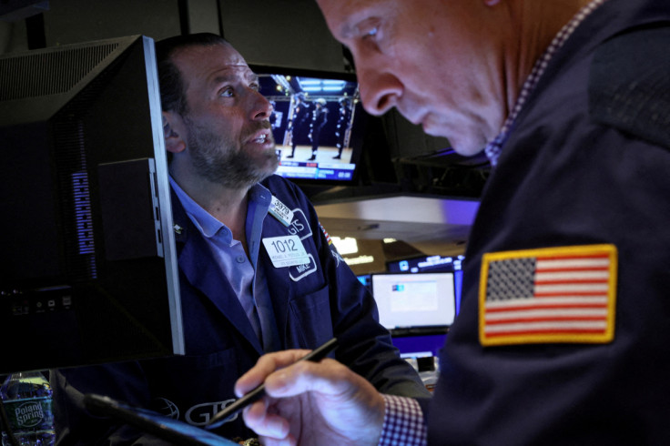 Traders work on the floor of the NYSE in New York