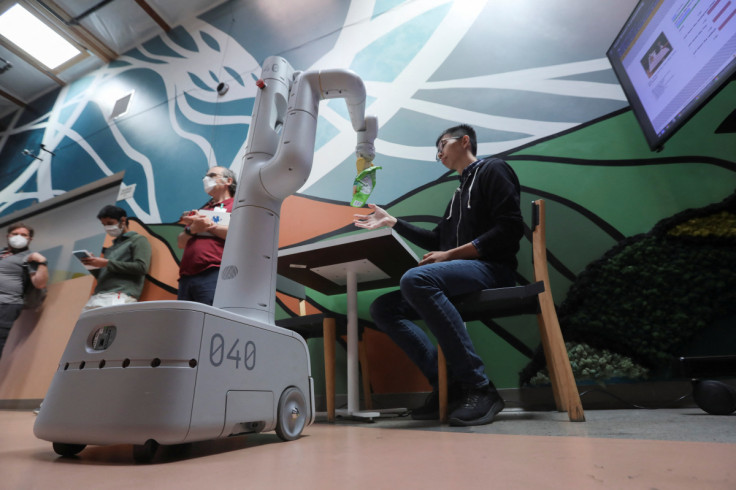 A Google robot moves while carrying a bag of chips during a demonstration for members of the media at Google’s robotics research space in Mountain View