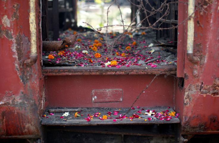 Flower petals scattered by the relatives of Godhra riots victims are pictured at the doorsteps of a train carriage in the western Indian state of Gujarat