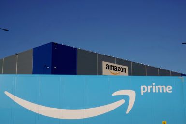 The logo of Amazon Prime Delivery is seen on the trailer of a truck outside the company logistics center in Lauwin-Planque