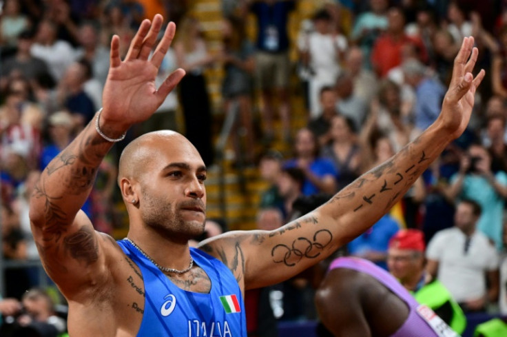 Italy's Lamont Marcell Jacobs salutes the Munich crowd