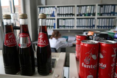 A view shows bottles and cans of soft drinks at a plant of the Chernogolovka company in Moscow Region