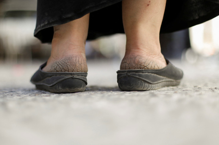 Umm Mohammed, mother of Sidra, a 17-year-old high school student, wears slippers at Jaramana in Damascus suburb