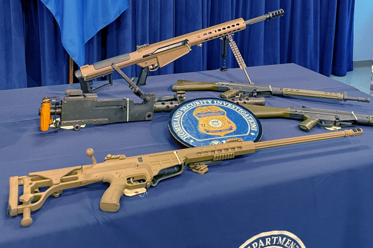 Seized weapons are displayed during a news conference in Miami