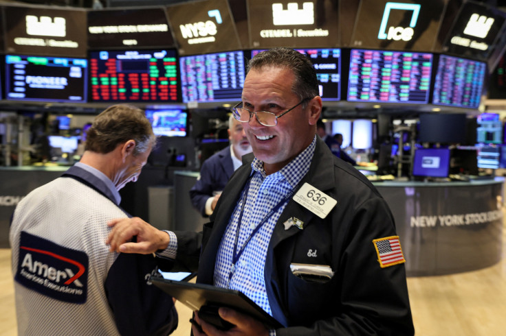 Traders work on the floor of the NYSE in New York