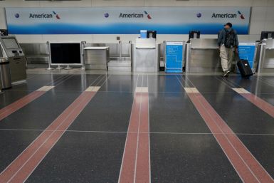 Customer seeks assistance at American Airlines counter at Reagan National airport in Washington