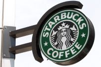 The Starbucks sign is seen outside one of its stores in New York