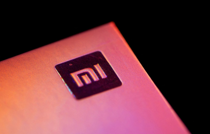 Xiaomi logo is seen on a smartphone box in this illustration