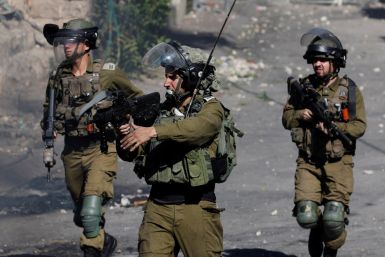 Palestinians clash with the Israeli army in Hebron