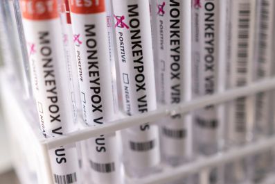 Illustration shows test tubes labelled "Monkeypox virus positive