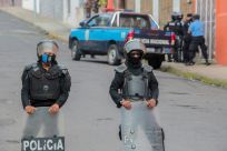 Nicaraguan police block the entrance of Matagalpa's Archbishop Curia on August 4, preventing bishop Rolando Alvarez from leaving
