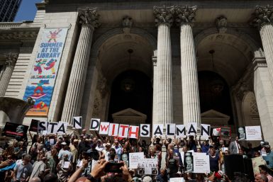 Supporters of author Salman Rushdie attend a reading and rally to show solidarity for free expression at the New York Public Library in New York