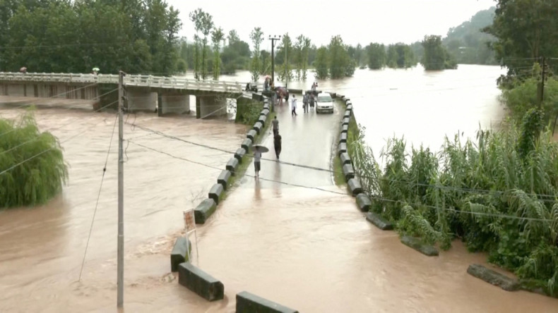 A general view of a flooded bridge following heavy rains in Mandi