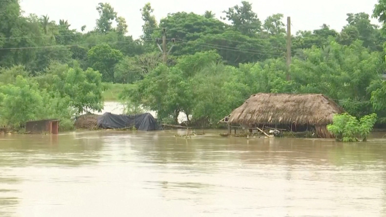 Huts get partially submerged in floodwater following heavy rains in Jagatsinghpur