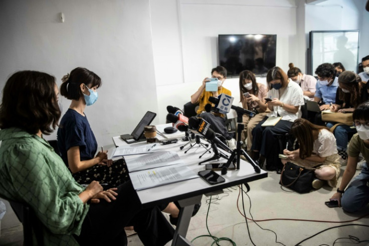 Rights lawyer Patricia Ho (L) and NGO programme manager Michelle Wong (2nd L) speak to the media in Hong Kong