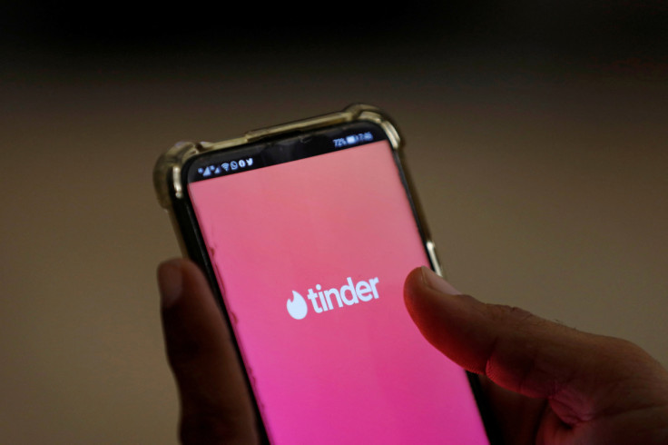 The dating app Tinder is shown on a mobile phone in this picture illustration