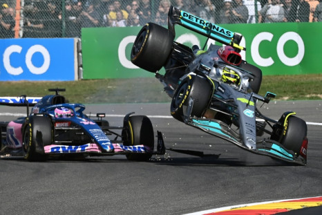 Lewis Hamilton said it was 'my fault' after his Mercedes (right) clipped the Alpine of Fernando Alonso