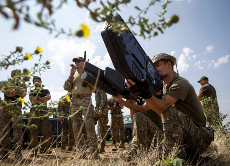 Ukrainian servicemen hold anti-drone guns as they take part in a training exercise not far from front line in Mykolaiv region