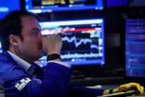 Traders work on the NYSE floor
