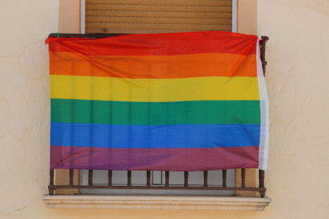 A rainbow flag hangs from the window of a house during the International LGBT Pride Day, in Villanueva de Algaidas