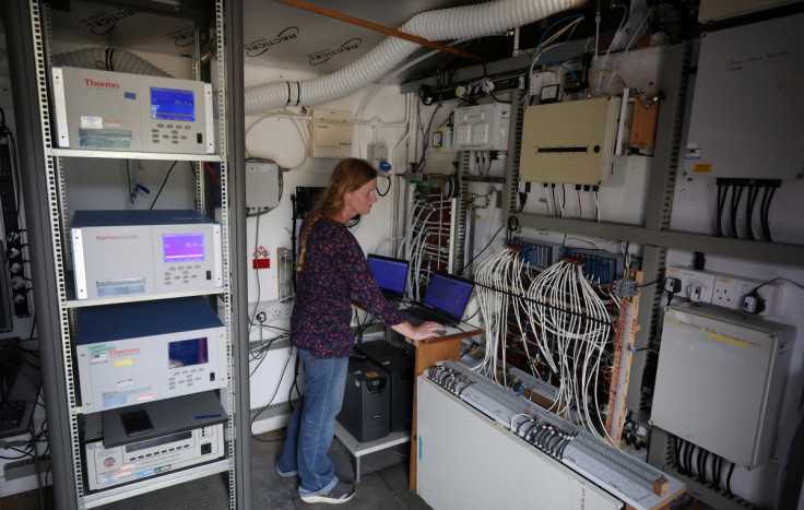 Plant ecophysiologist Felicity Hayes monitors the level of Ozone being added to solar domes at the UK Centre for Ecology and Hydrology research site near Bangor