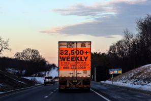 A tractor trailer advertising job opportunities drives south on Route 81 in Virginia
