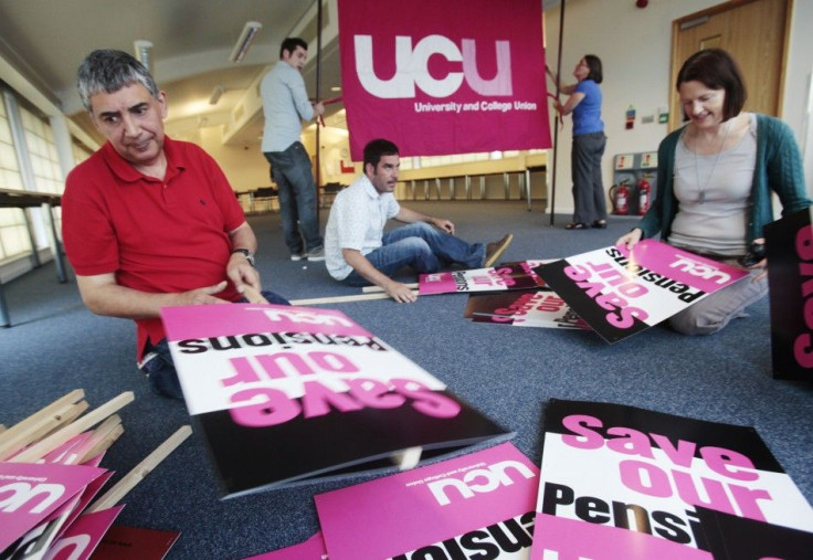Members of the University and College Union (UCU) campaigns team make placards for Thursday&#039;s planned protest against government plans to cut public sector pensions, at their headquarters in London
