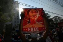 Protesters call for Aung San Suu Kyi's release during a rally in Yangon last year