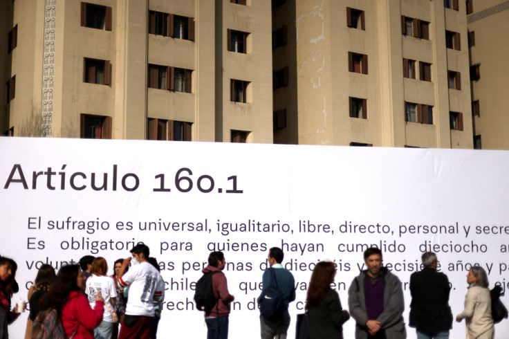 Banner with item number 160.1 of the proposed new Chilean constitution is placed in Santiago