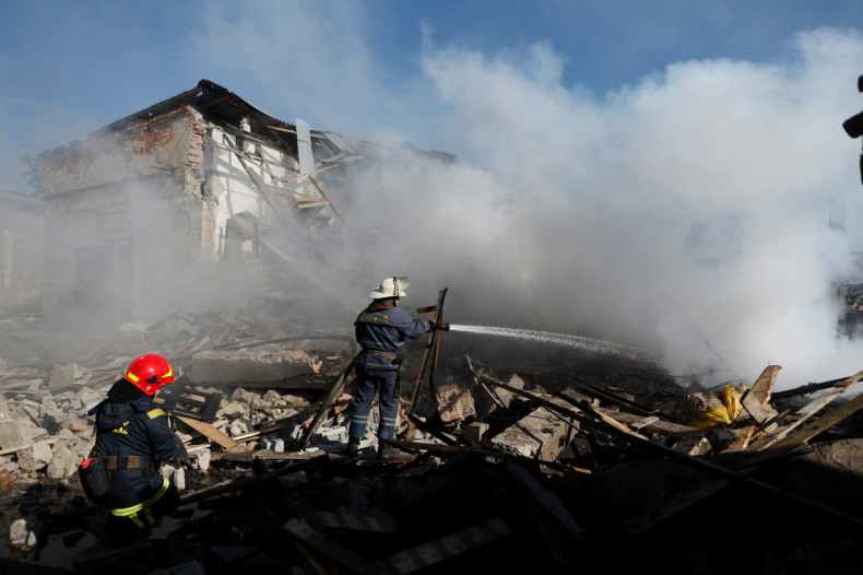 Ukrainian firefighters put out fire in a destroyed wholesale market after a Russian strike in Kramatorsk