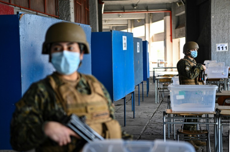 Soldiers provide security at a polling station being set up ahead of the September 4, 2022 referendum in Chile on whether to adopt a new constitution