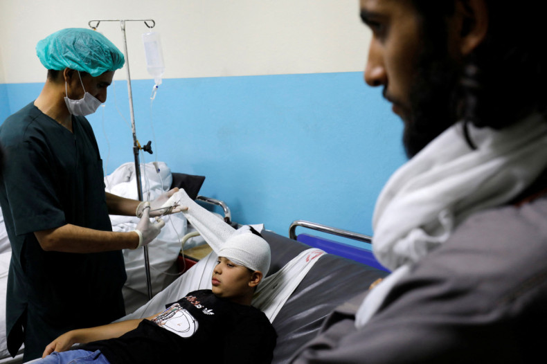 A wounded boy is treated inside a hospital in Kabul