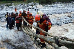 Rescue workers evacuate residents from Luding county in China's southwestern Sichuan province after Monday's devastating earthquake
